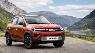 Dacia Spring electric car parked on a scenic mountain road in Europe, showcasing why Europe's cheapest EV is still a smart choice in 2026