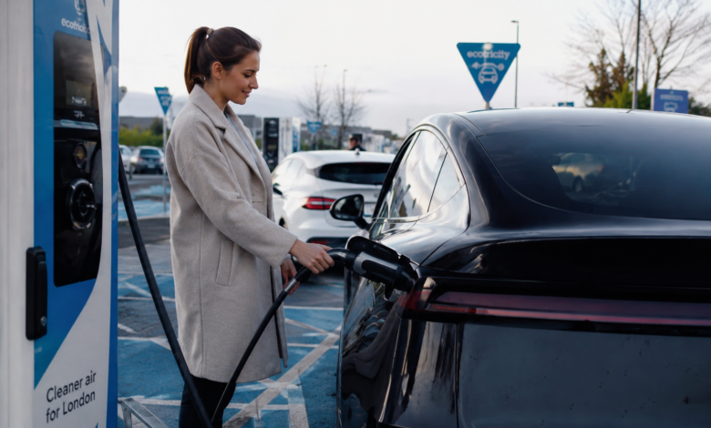 Essential EV Charging Etiquette UK at a public EV charging station with an electric car driver