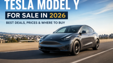 Tesla Model Y for sale in 2026 driving on a wide highway during sunset