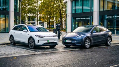 Leapmotor C10 vs Tesla Model Y side by side on a modern UK city street, comparing two electric SUVs